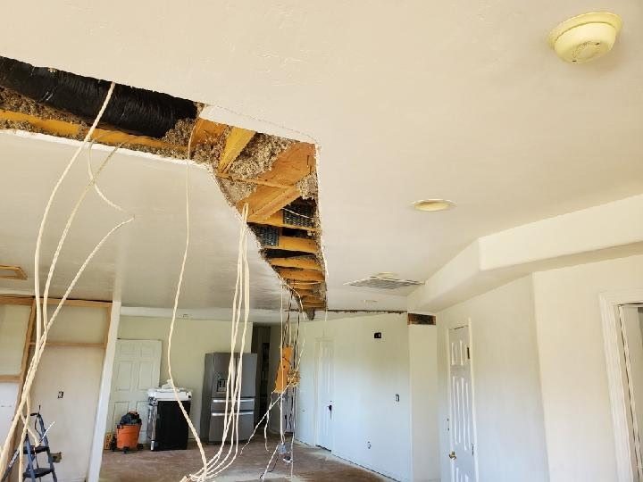 Before: drywall ceiling torn open with wires hanging, Prescott Valley home