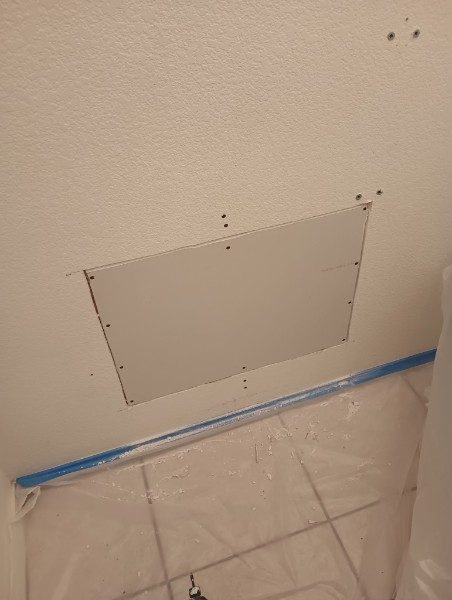 Drywall patch set into an existing wall