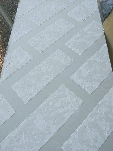Close-up of drywall texture over finished seams