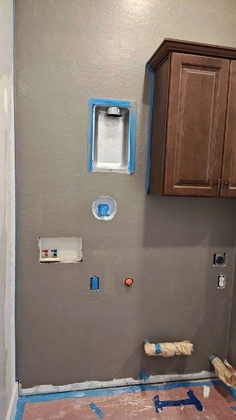 After: laundry wall rehung, finished and painted